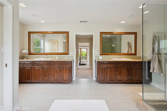 a view of a hallway with granite countertop a stove and a sink
