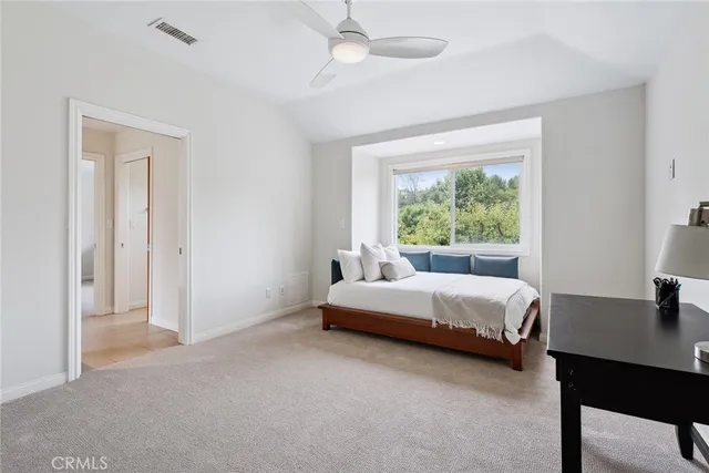 a bed room with a bed and a window