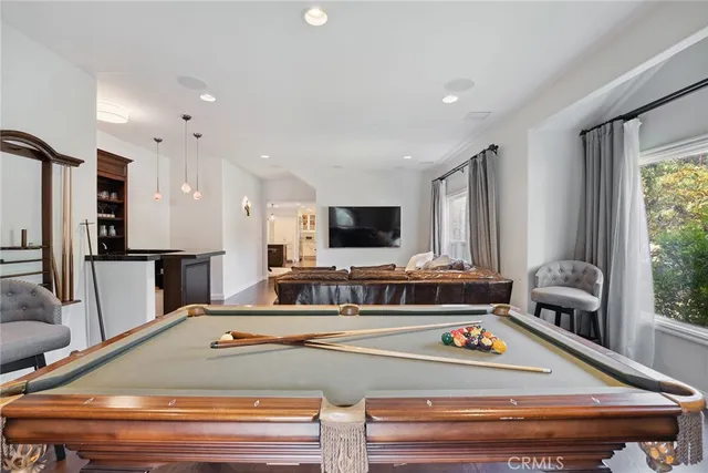 a view of kitchen with stainless steel appliances granite countertop refrigerator sink and stove
