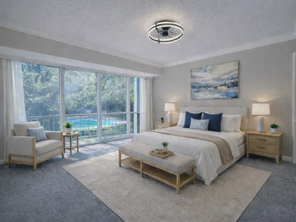 a spacious bedroom with a bed and a couch