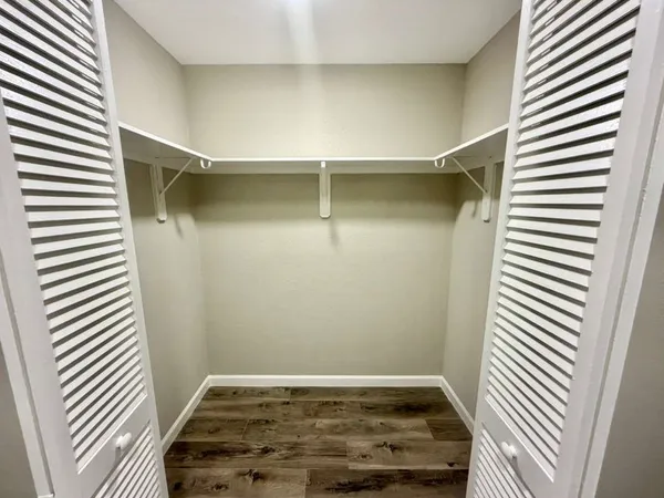 an empty room with wooden floor