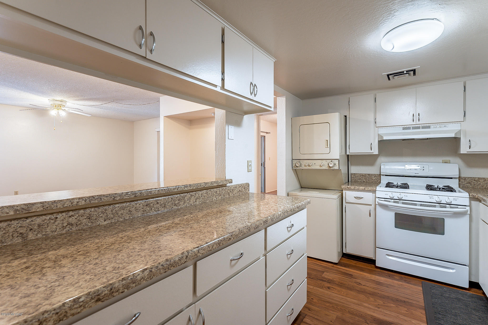 3750 North Country Club Road, Unit 7 Tucson, AZ 85716 - Photo 7 of 26 a kitchen with granite countertop cabinets stainless steel appliances and a counter space