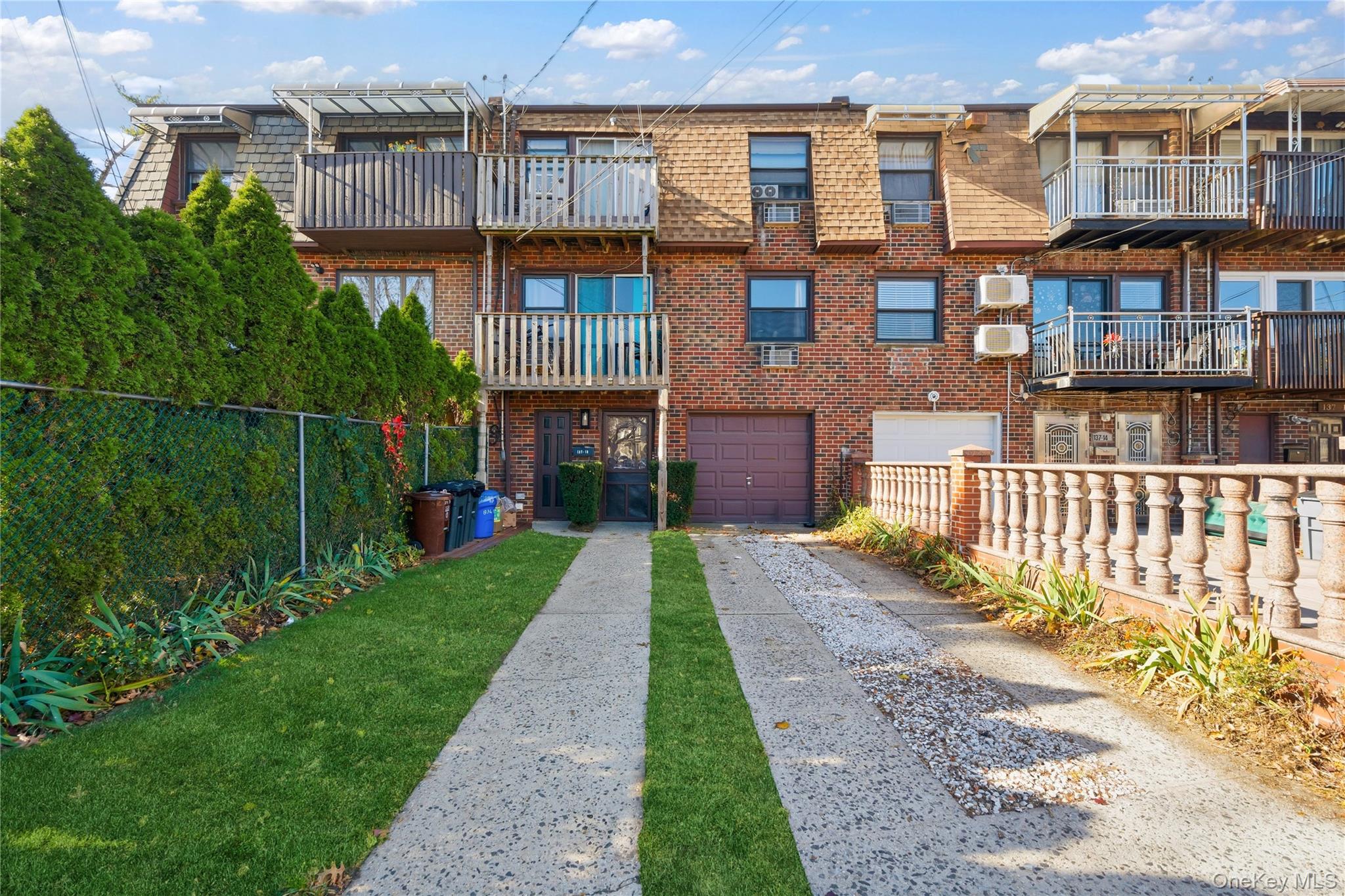 a front view of a building with a yard