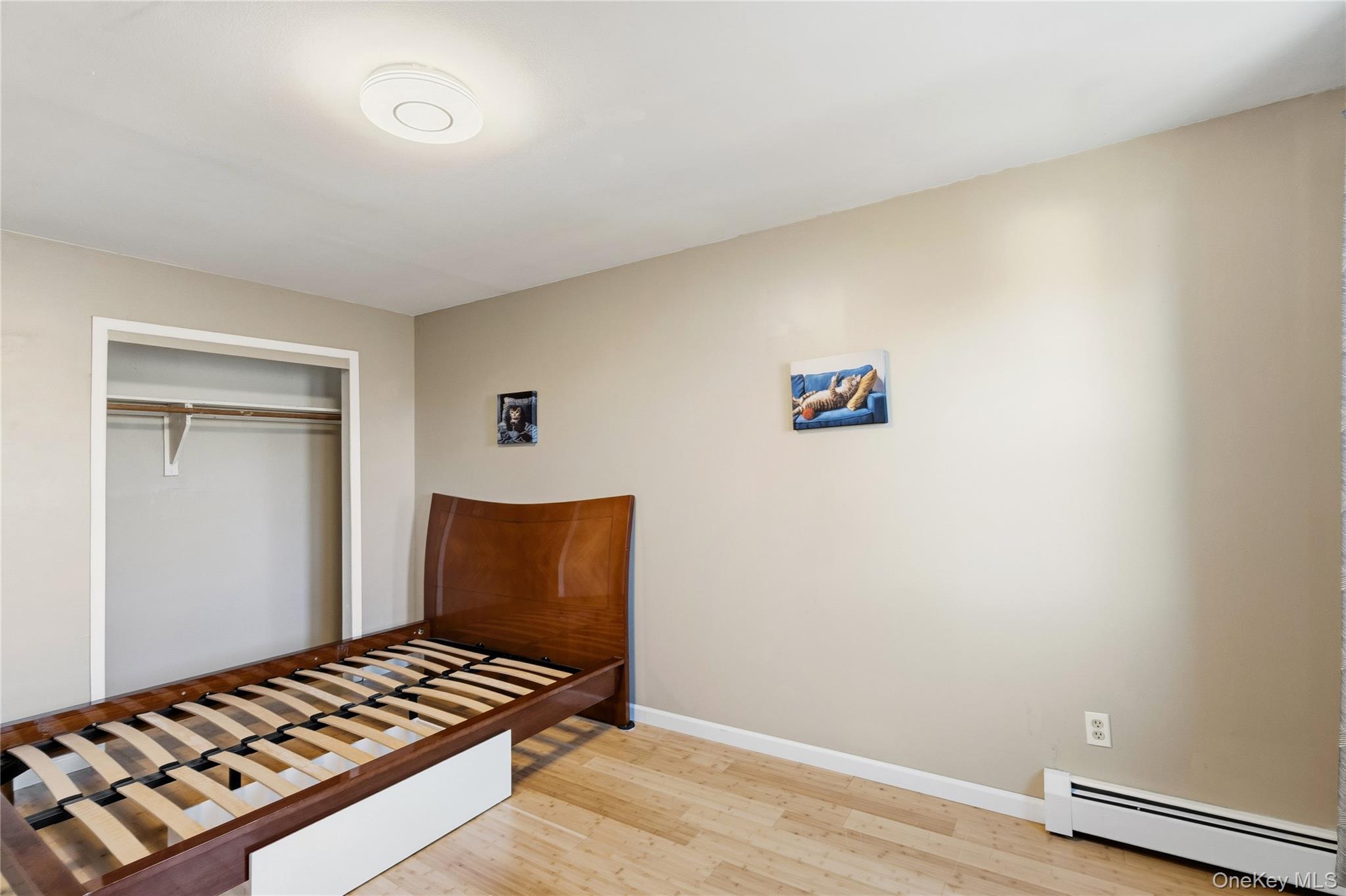 13716 88th Street Queens, NY 11417 - Photo 11 of 26 a view of a livingroom with wooden floor and lounge chair