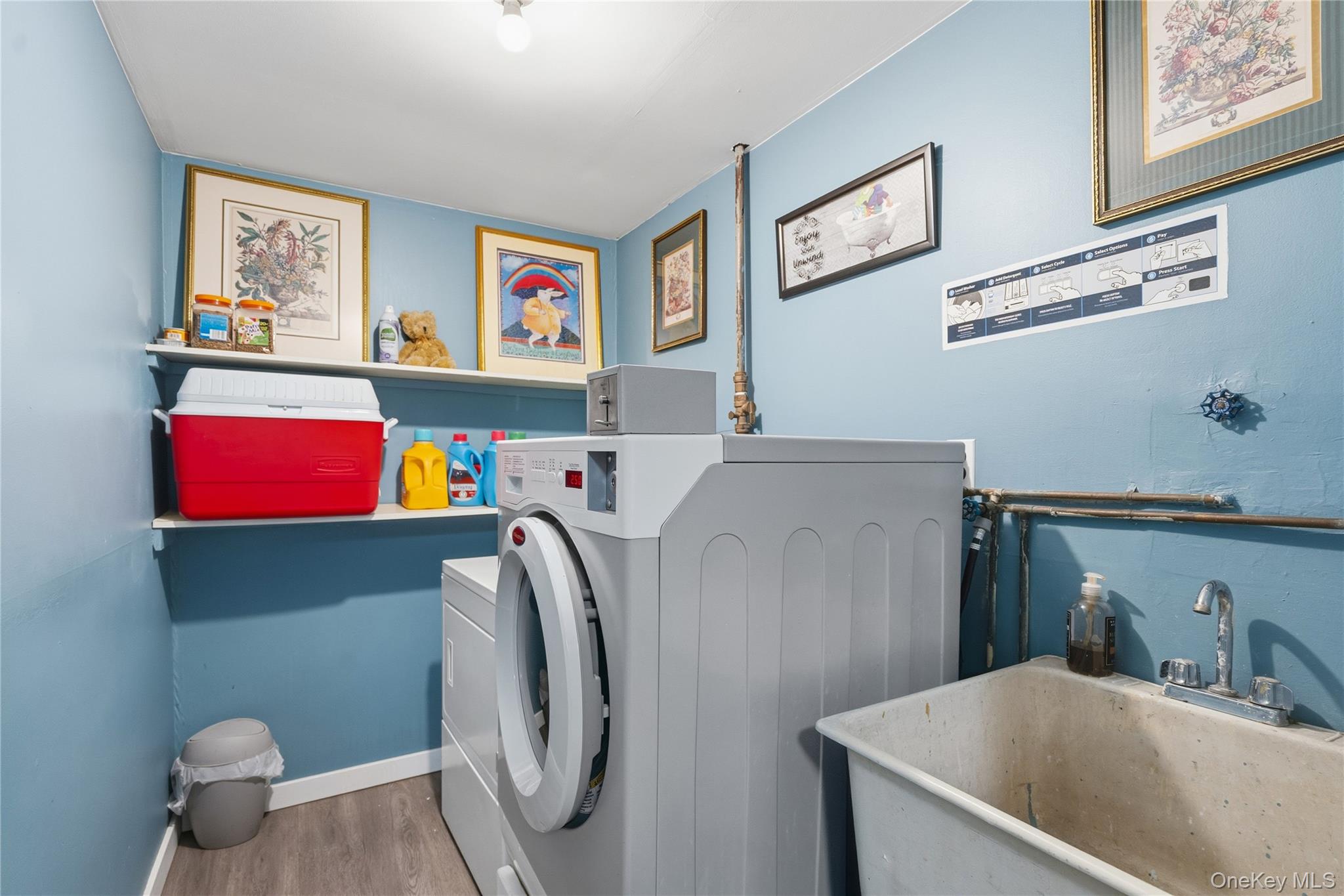 13716 88th Street Queens, NY 11417 - Photo 12 of 26 a utility room with cabinets dryer and washer