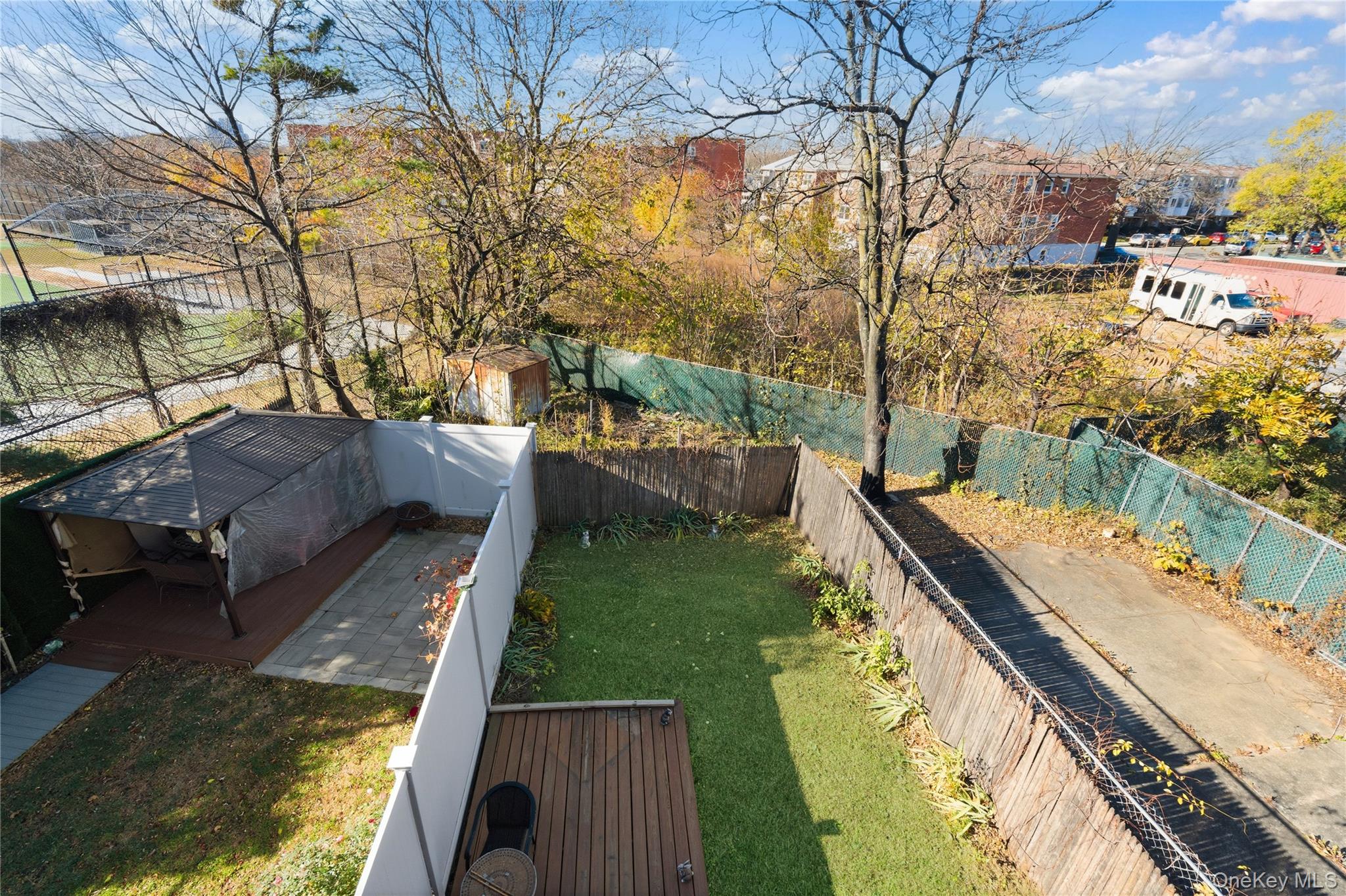 13716 88th Street Queens, NY 11417 - Photo 14 of 26 a view of a yard with large trees