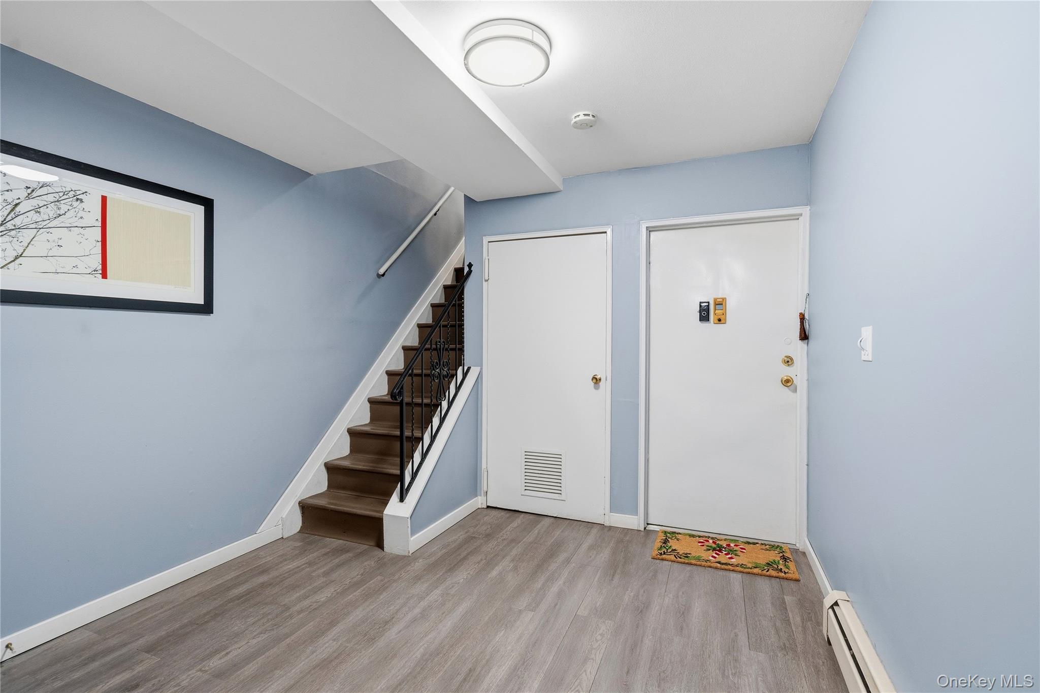 13716 88th Street Queens, NY 11417 - Photo 2 of 26 an empty room with wooden floor and entryway