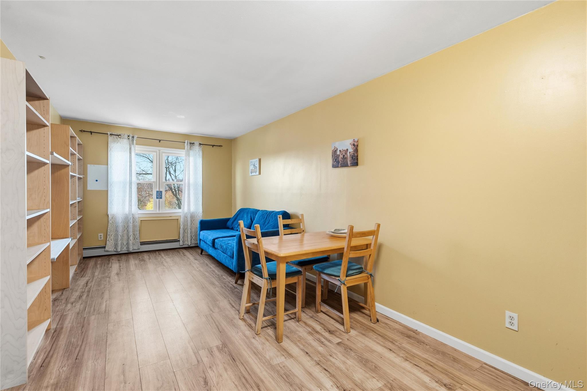 13716 88th Street Queens, NY 11417 - Photo 4 of 26 a view of a dining room with furniture and wooden floor