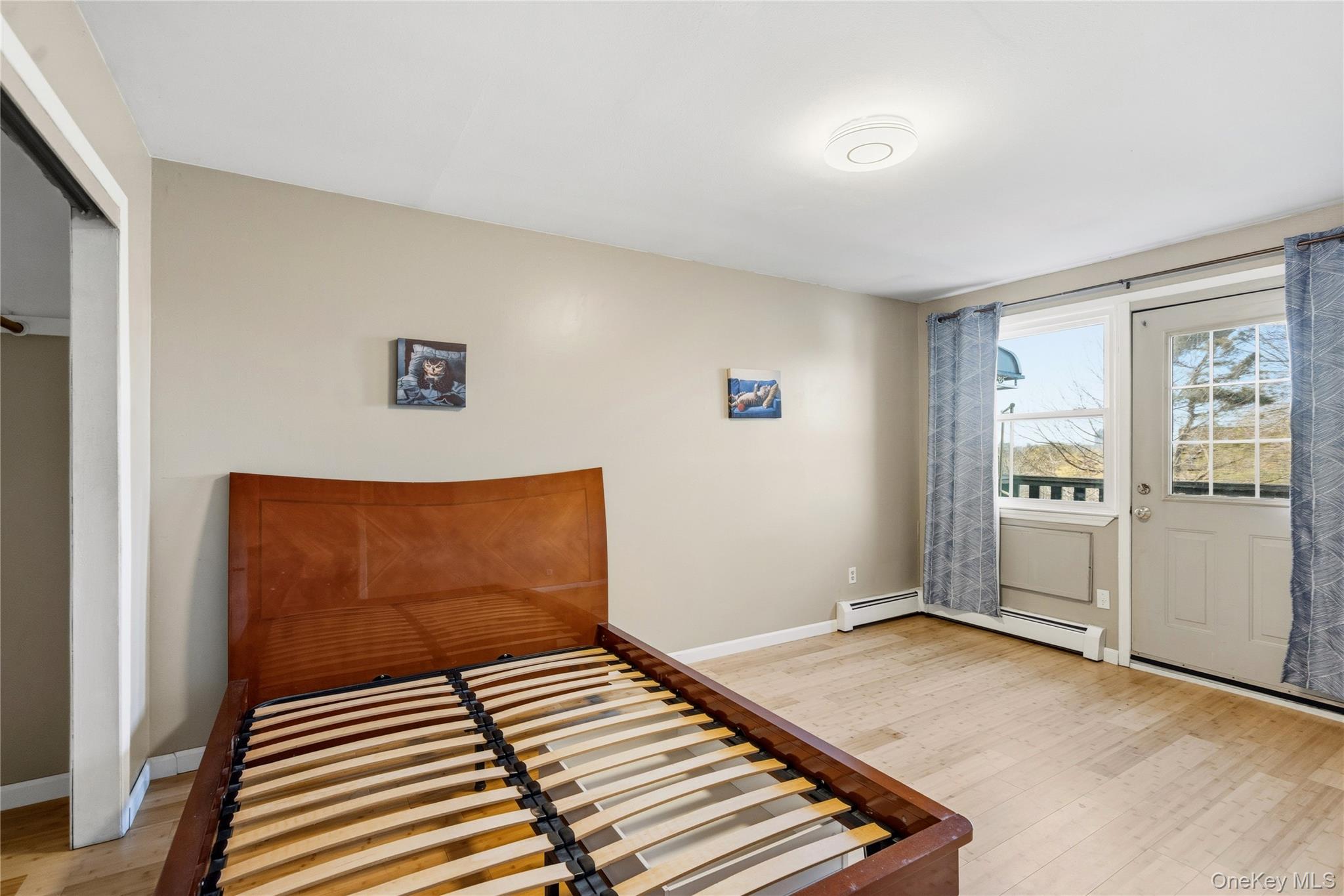 13716 88th Street Queens, NY 11417 - Photo 10 of 26 a view of a livingroom with wooden floor and windows