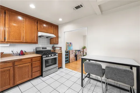 a kitchen with a refrigerator and a sink