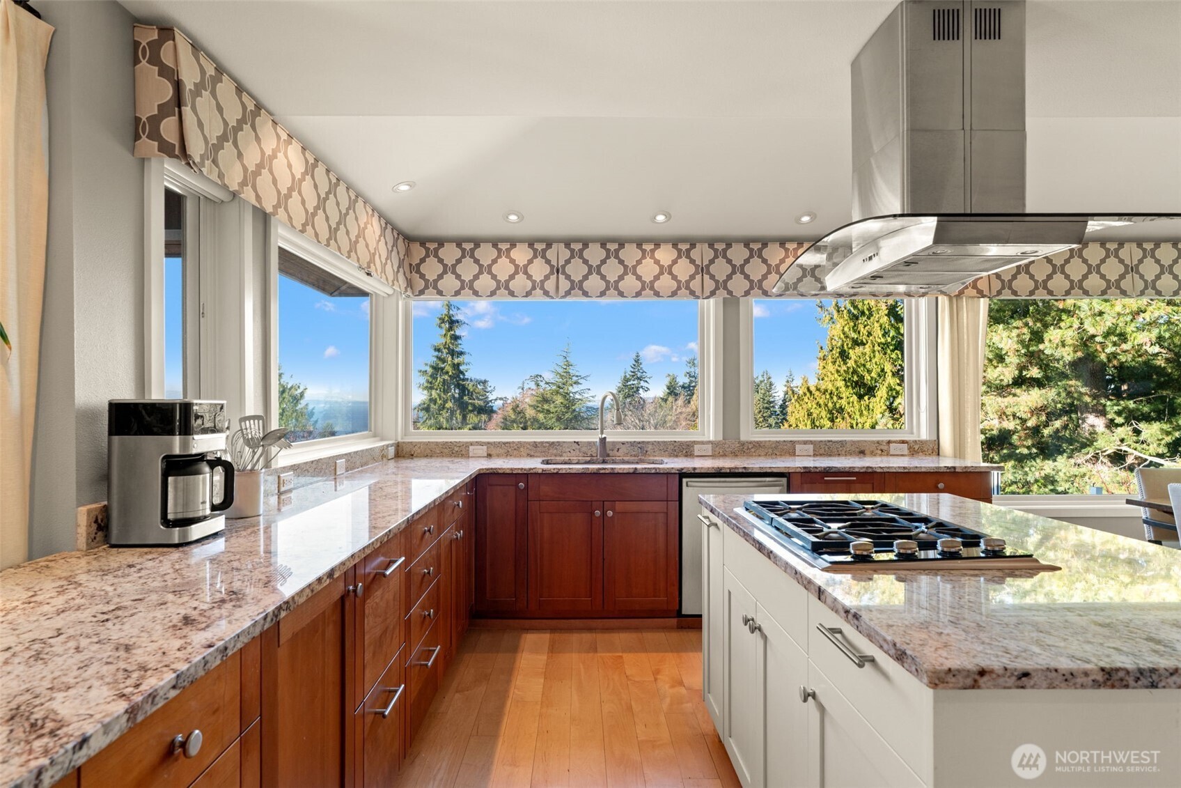 7819 175th Street Southwest Edmonds, WA 98026 - Photo 12 of 40 a kitchen with stainless steel appliances granite countertop a stove a sink and a wooden cabinets