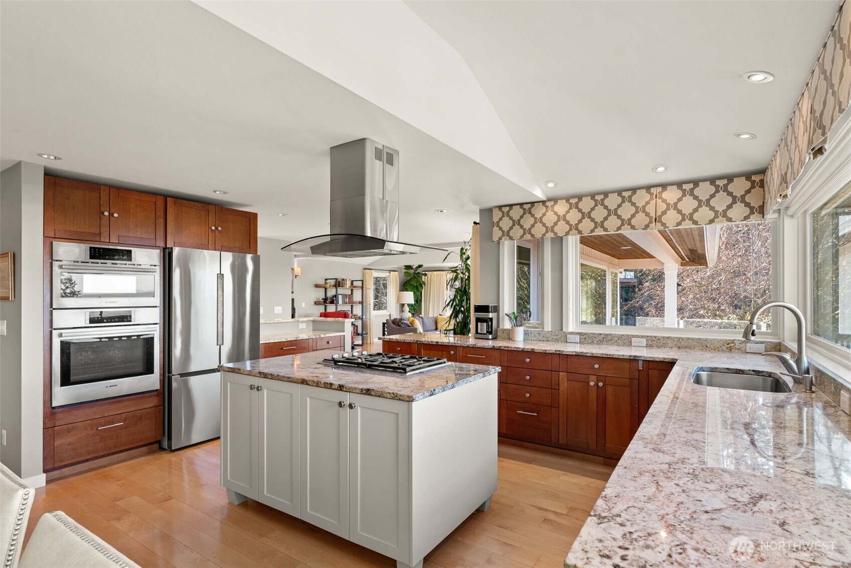7819 175th Street Southwest Edmonds, WA 98026 - Photo 13 of 40 a kitchen with stainless steel appliances granite countertop a sink stove and refrigerator