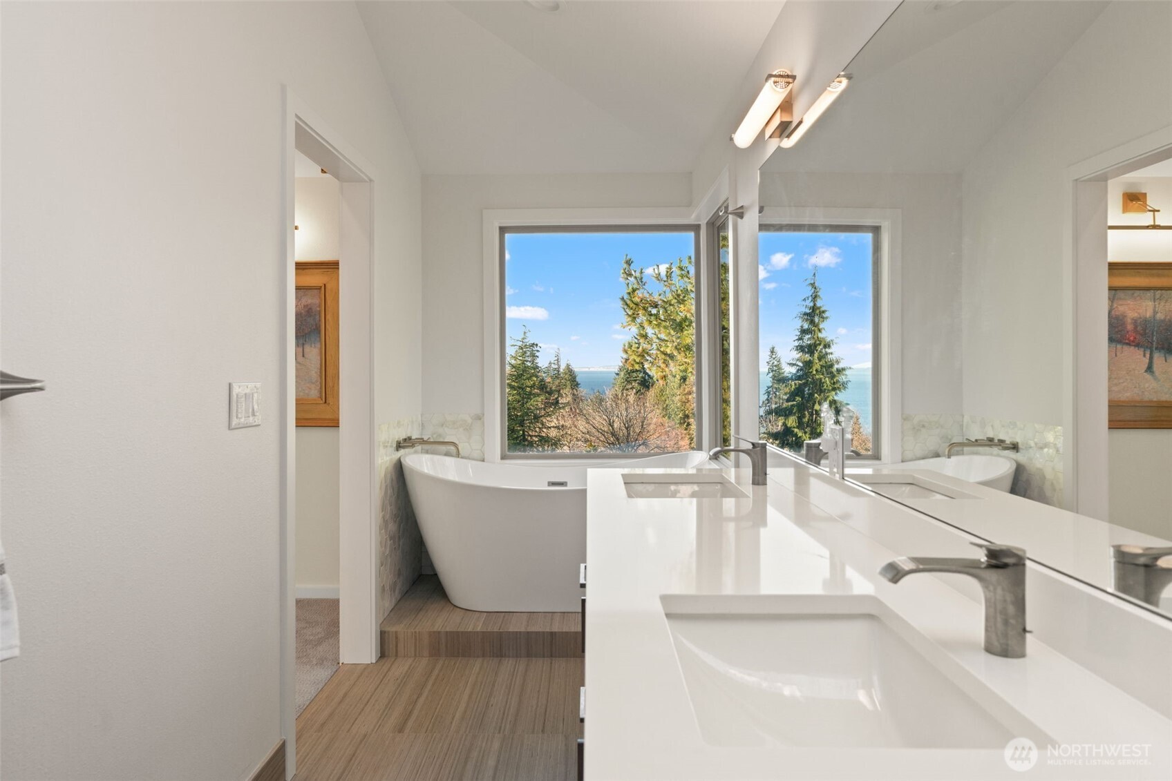 7819 175th Street Southwest Edmonds, WA 98026 - Photo 21 of 40 a room with wooden floor and a large window