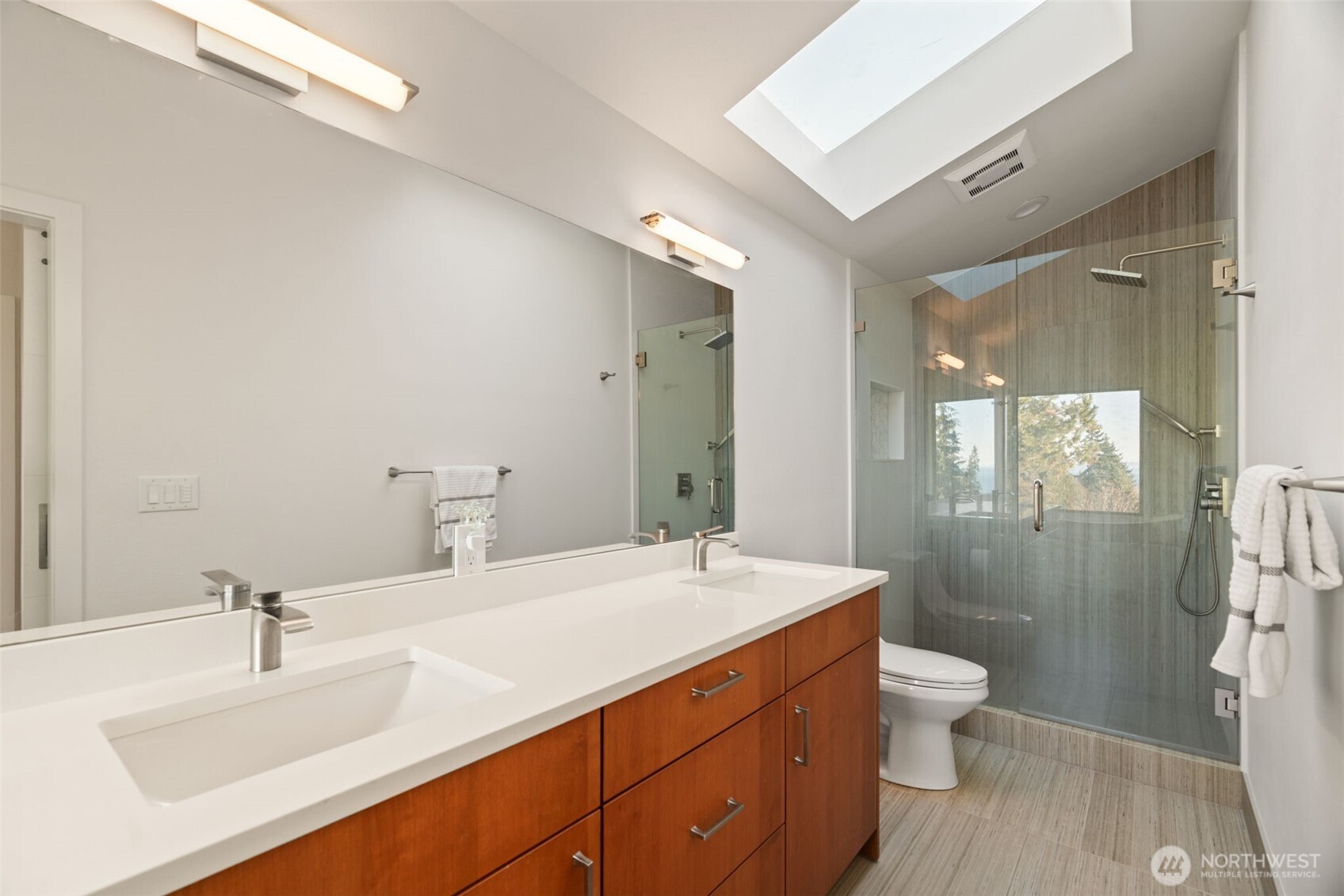 7819 175th Street Southwest Edmonds, WA 98026 - Photo 22 of 40 a bathroom with a double vanity sink toilet and shower