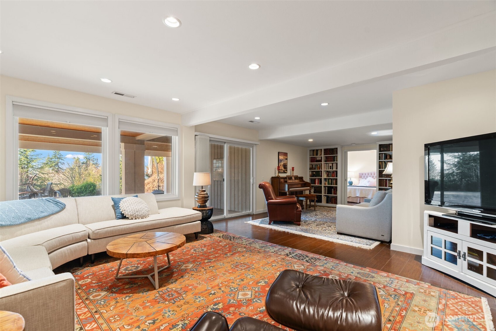 7819 175th Street Southwest Edmonds, WA 98026 - Photo 26 of 40 a living room with furniture and a wooden floor