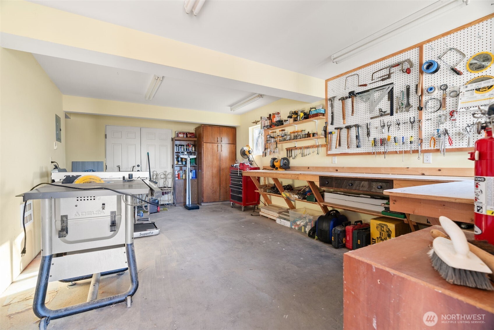 7819 175th Street Southwest Edmonds, WA 98026 - Photo 32 of 40 a room with furniture a washer and a fireplace