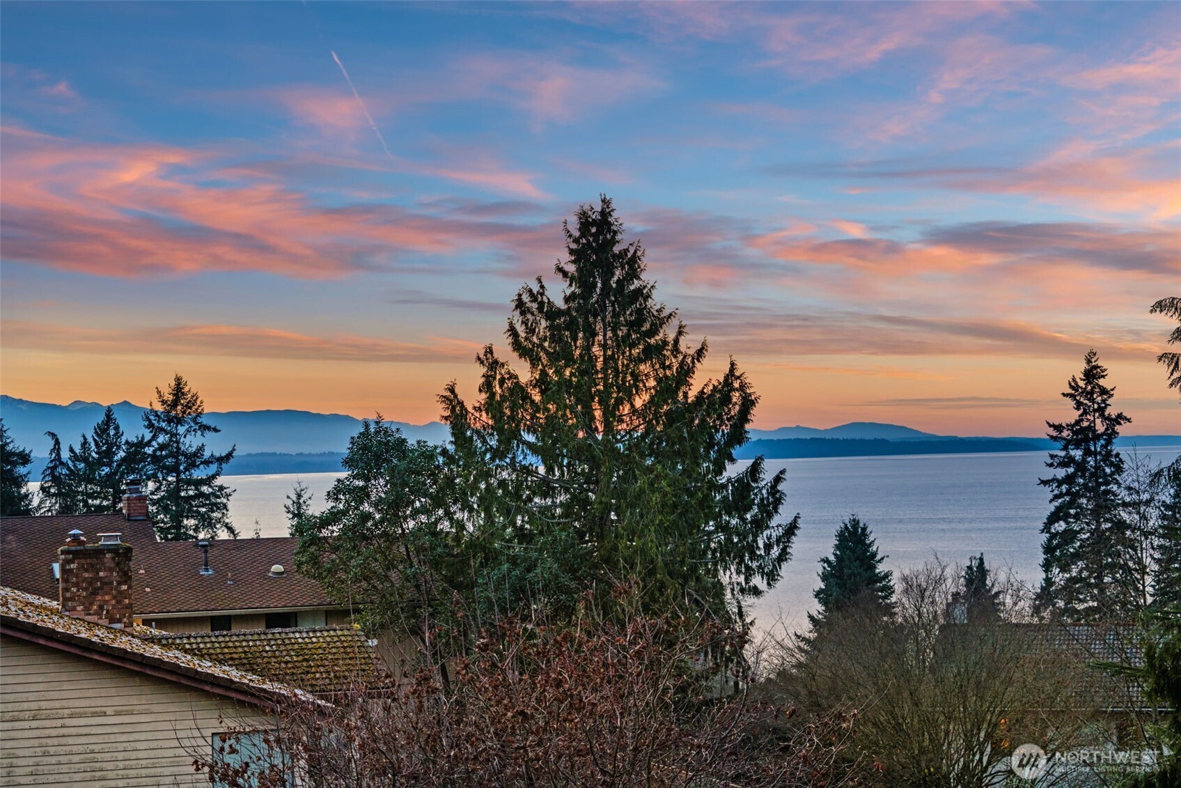 7819 175th Street Southwest Edmonds, WA 98026 - Photo 37 of 40 a view of a lake with a building in the background