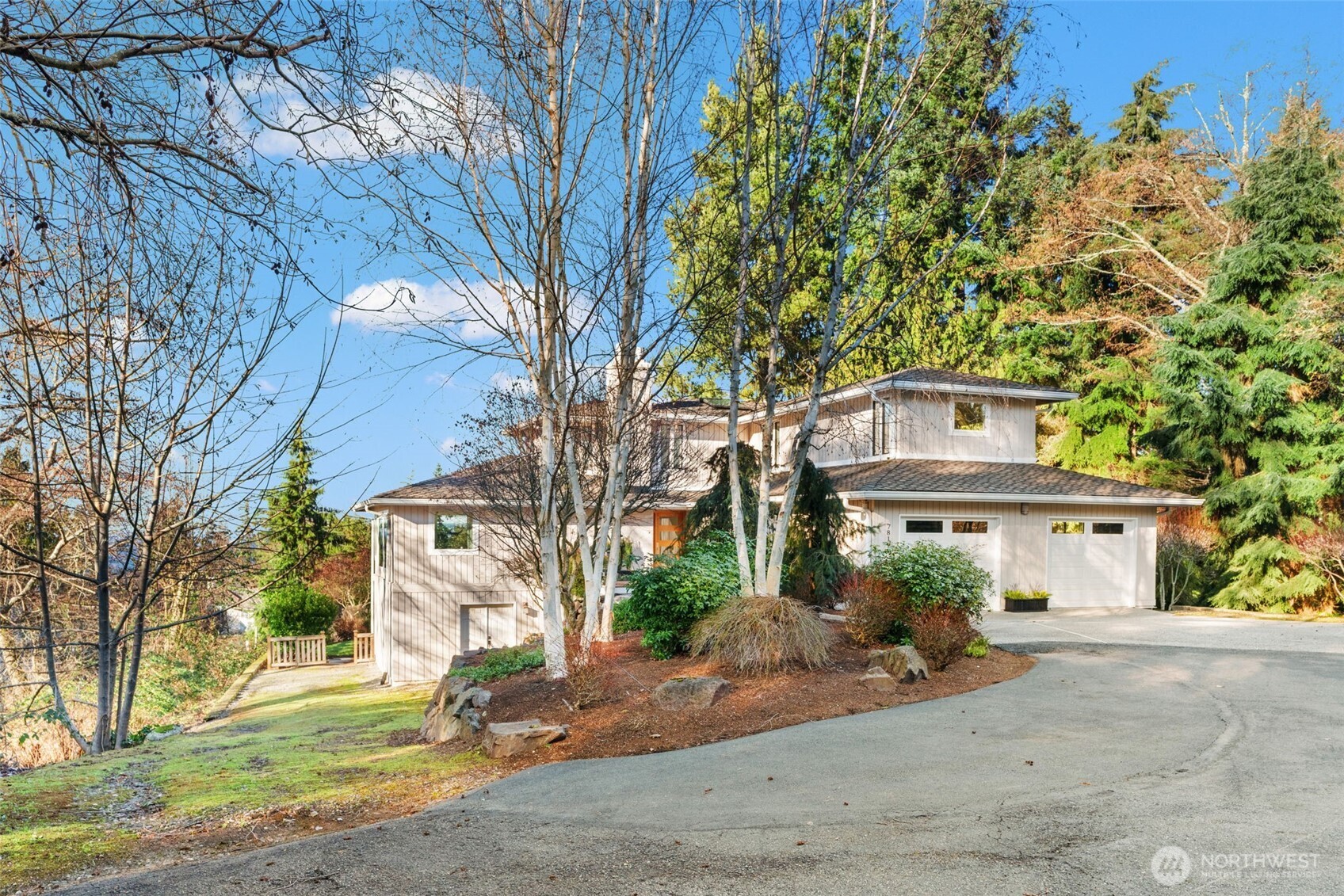 7819 175th Street Southwest Edmonds, WA 98026 - Photo 6 of 40 a front view of a house with a yard and garage