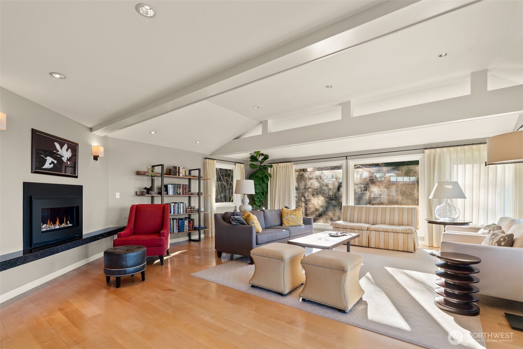 7819 175th Street Southwest Edmonds, WA 98026 - Photo 10 of 40 a living room with furniture and a fireplace