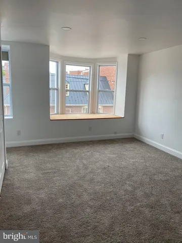 an empty room with a hallway