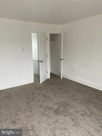 a kitchen with stainless steel appliances kitchen island granite countertop a stove a sink and a microwave