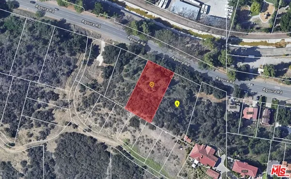 a bird view of a house with a yard