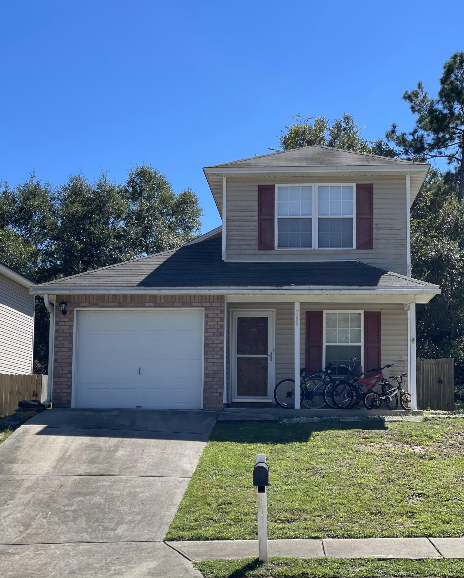 289 Dahlquist Drive Crestview, FL 32539 - Photo 1 of 1 a front view of a house with garden