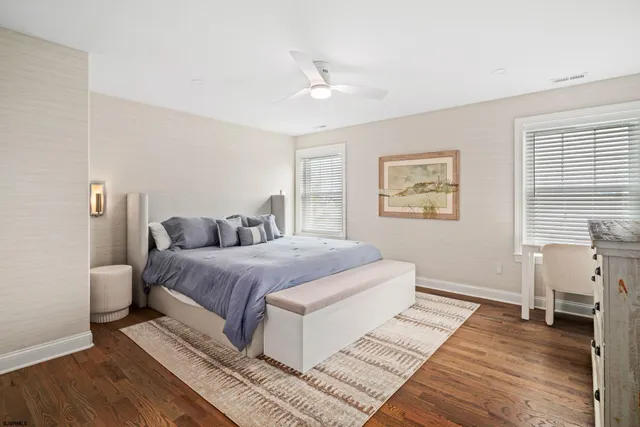 a spacious bedroom with a large bed and a window