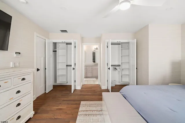 a bedroom with a bed and a sink