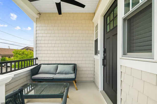 a view of balcony with furniture