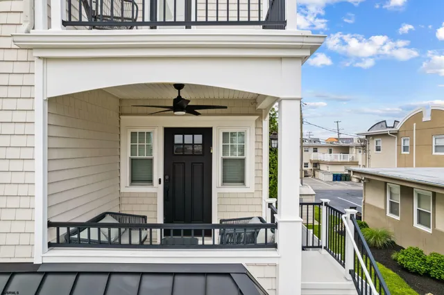 a front view of a house with large windows