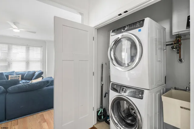 a utility room with sink dryer and washer