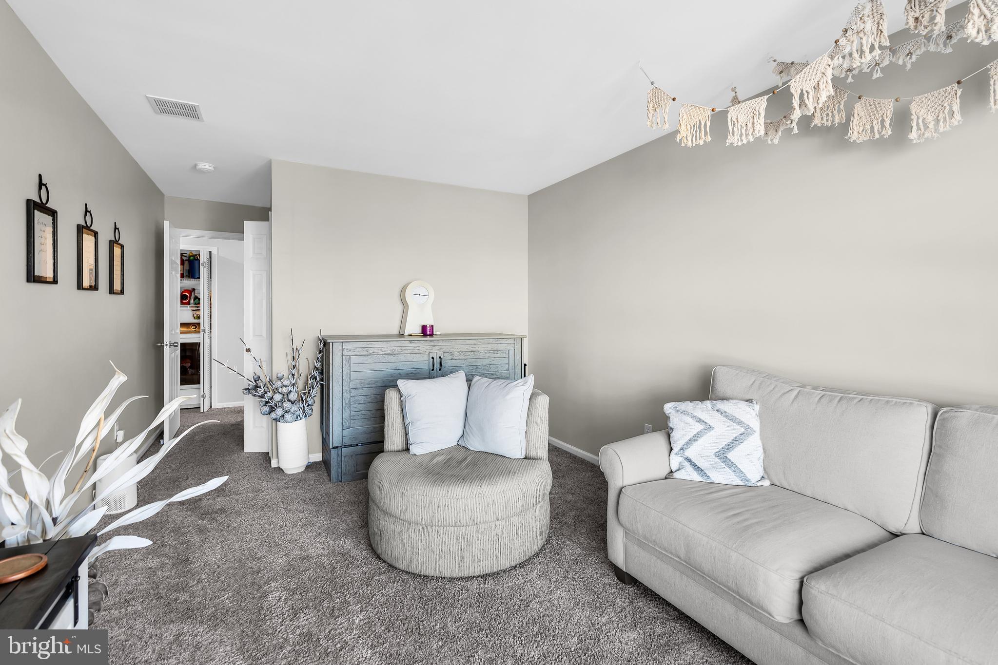 1007 Inland Road Forked River, NJ 08731 - Photo 15 of 27 a living room with furniture and a couch