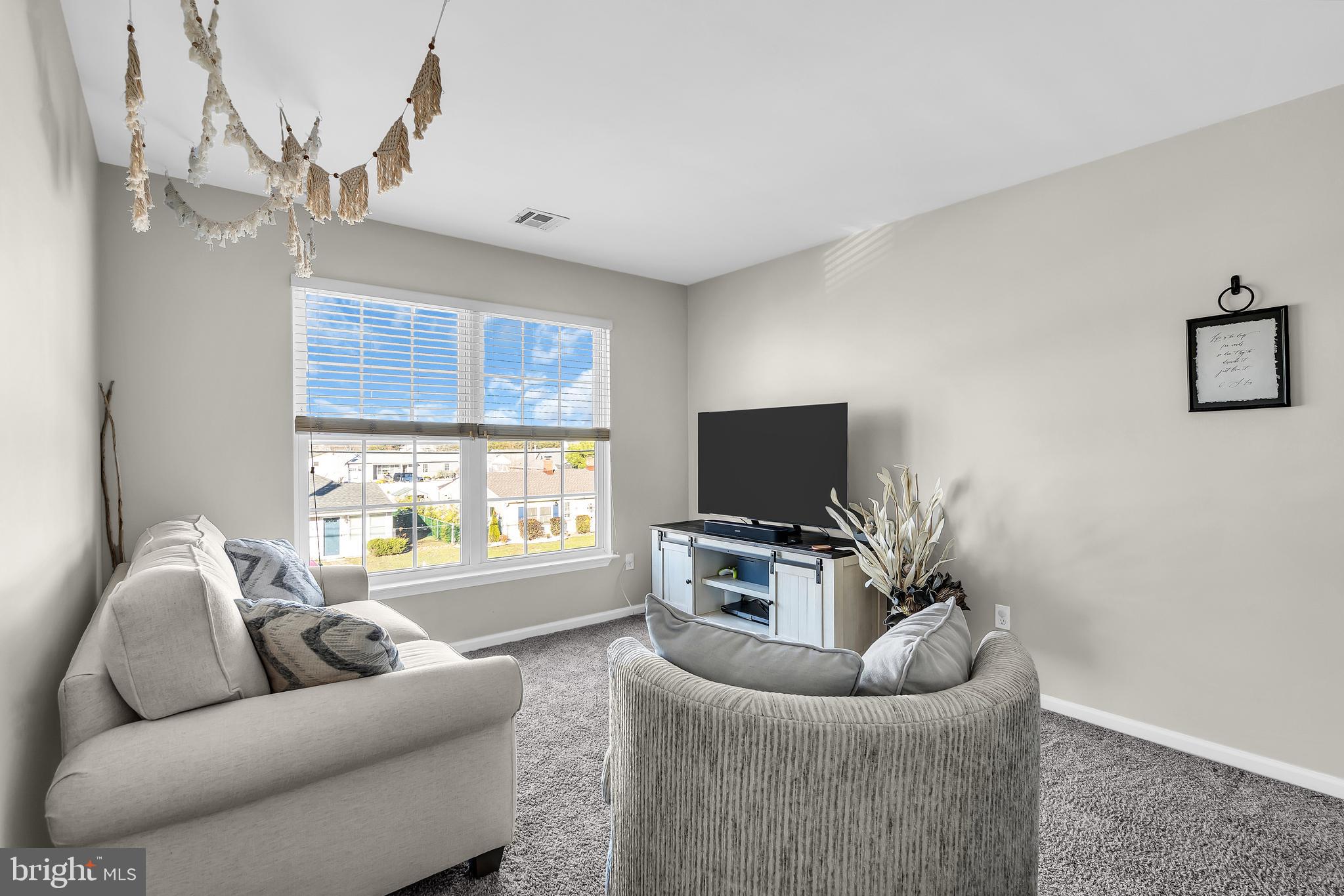 1007 Inland Road Forked River, NJ 08731 - Photo 16 of 27 a living room with furniture and a flat screen tv