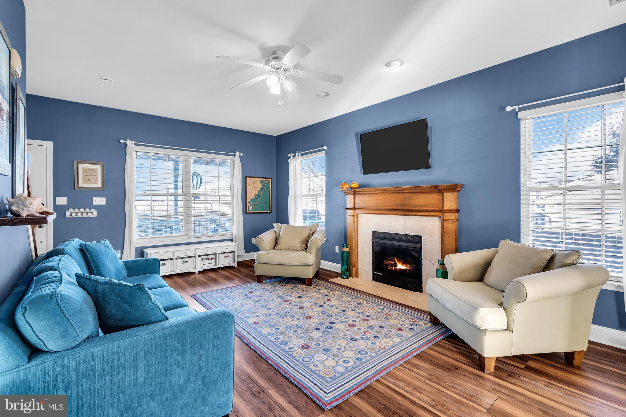 1007 Inland Road Forked River, NJ 08731 - Photo 4 of 27 a living room with furniture a flat screen tv and a fireplace