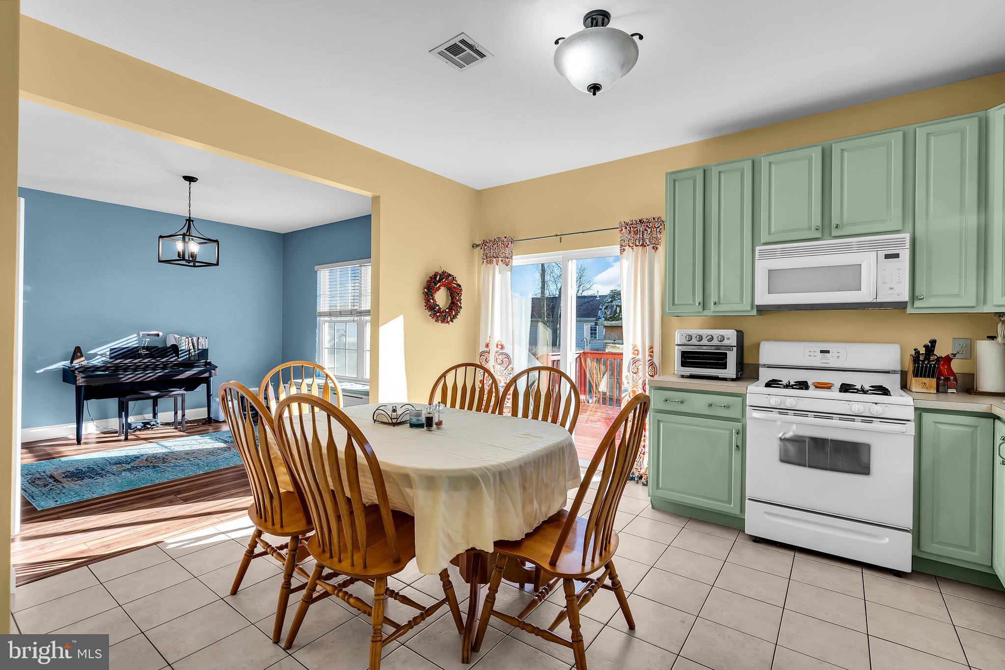 1007 Inland Road Forked River, NJ 08731 - Photo 8 of 27 a view of a dining room with furniture and chandelier