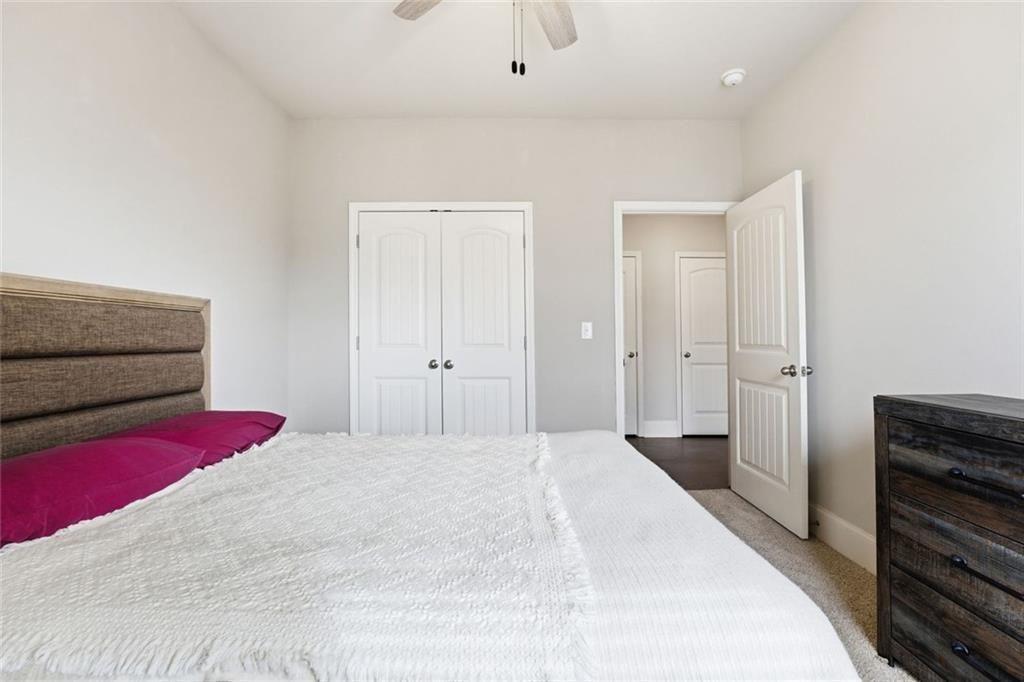 419 After Glow Summit Canton, GA 30114 - Photo 11 of 41 a bedroom with a bed and a dresser