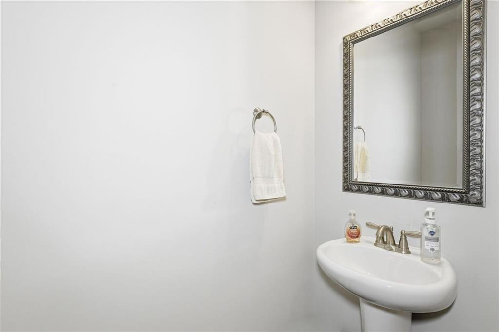 419 After Glow Summit Canton, GA 30114 - Photo 14 of 41 a bathroom with a sink and a mirror