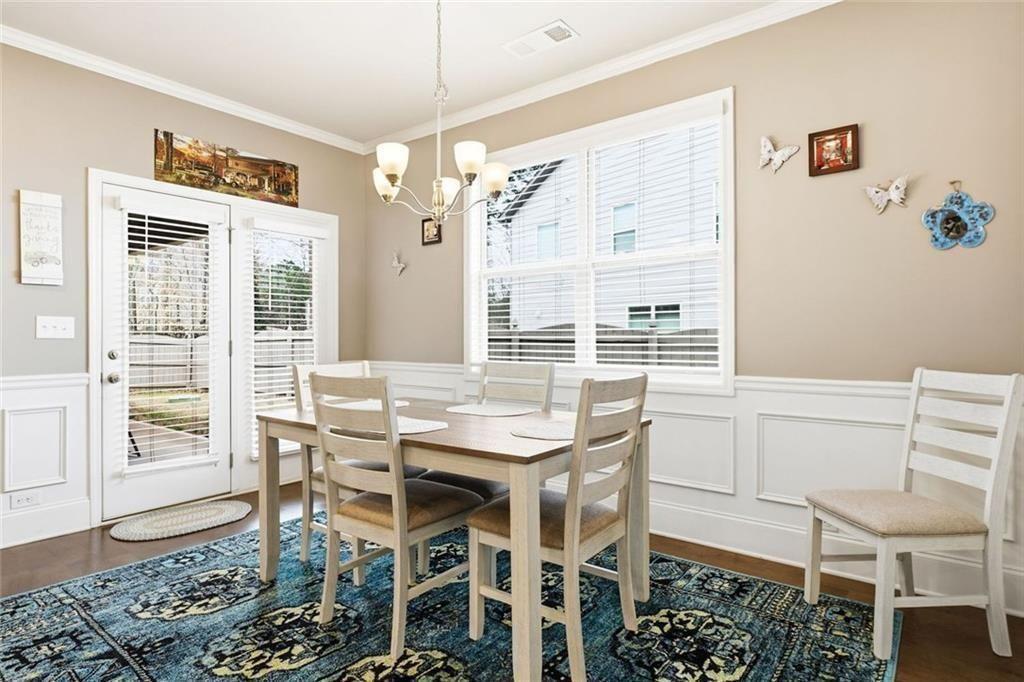 419 After Glow Summit Canton, GA 30114 - Photo 26 of 41 a view of a dining room with furniture and a chandelier