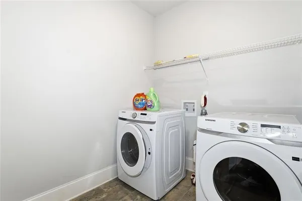 a utility room with dryer and washer