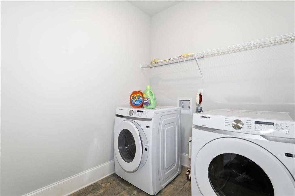419 After Glow Summit Canton, GA 30114 - Photo 27 of 41 a utility room with dryer and washer