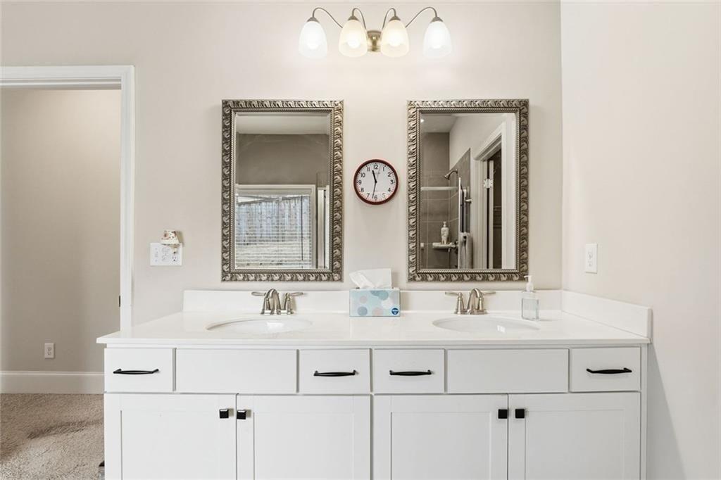 419 After Glow Summit Canton, GA 30114 - Photo 33 of 41 a bathroom with a sink and a mirror