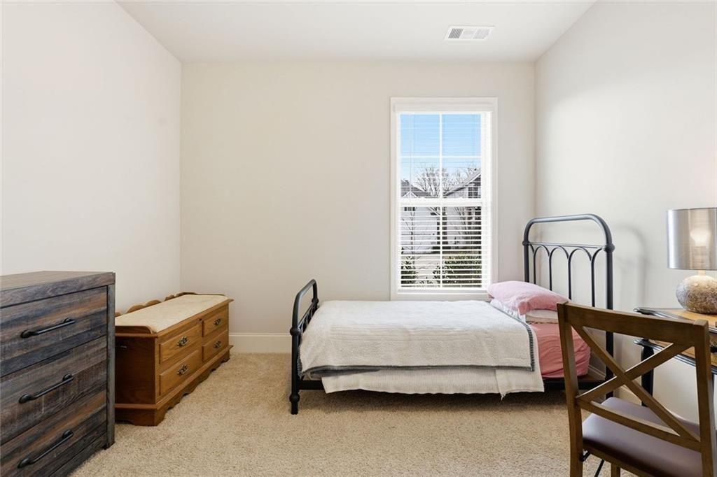 419 After Glow Summit Canton, GA 30114 - Photo 8 of 41 a bedroom with a bed and a window