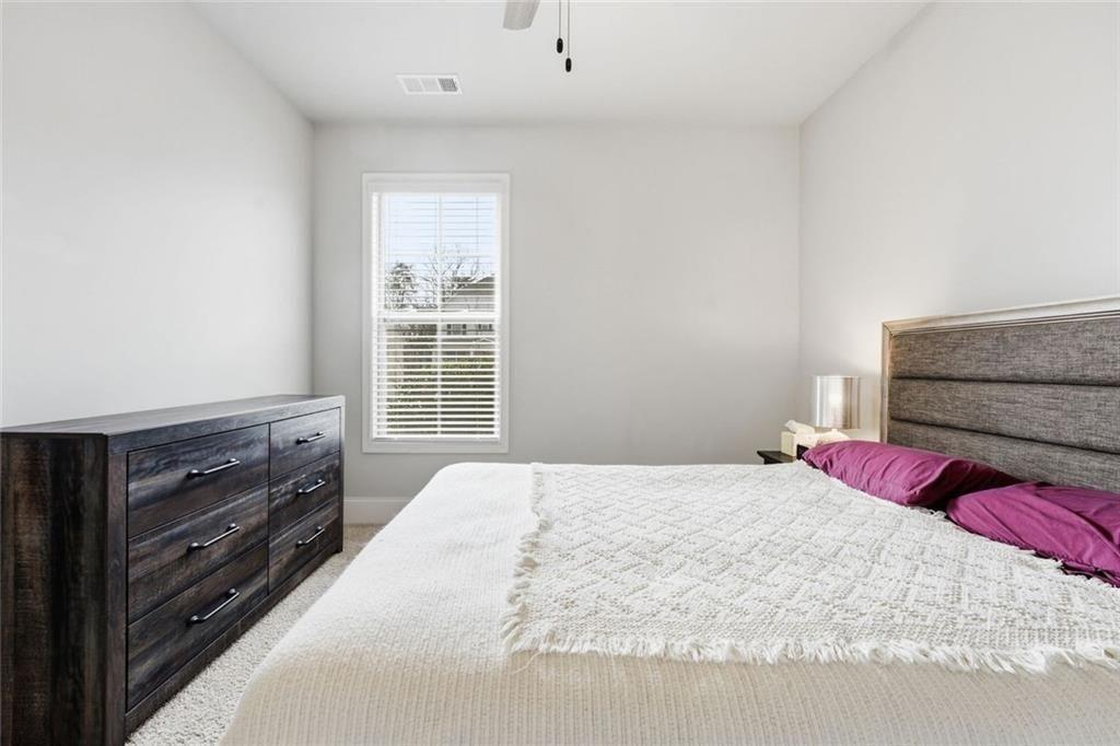 419 After Glow Summit Canton, GA 30114 - Photo 10 of 41 a bedroom with a bed and a window
