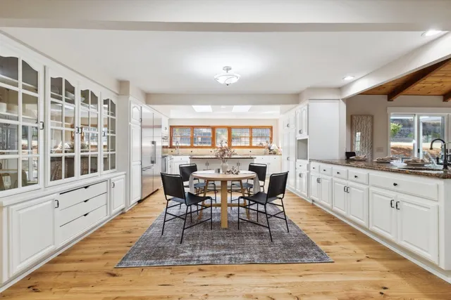 a kitchen with sink stove and refrigerator