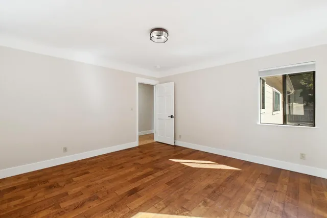 a kitchen with stainless steel appliances granite countertop a sink and a refrigerator