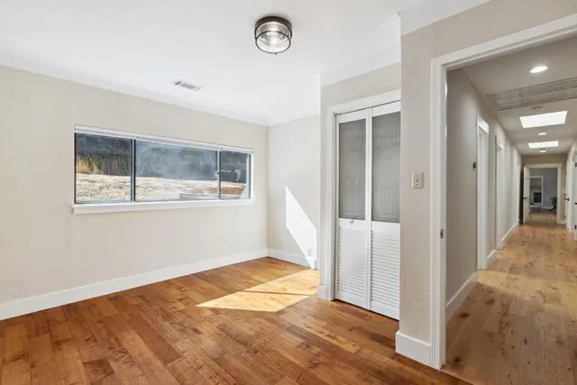a view of a patio with table and chairs next to a yard