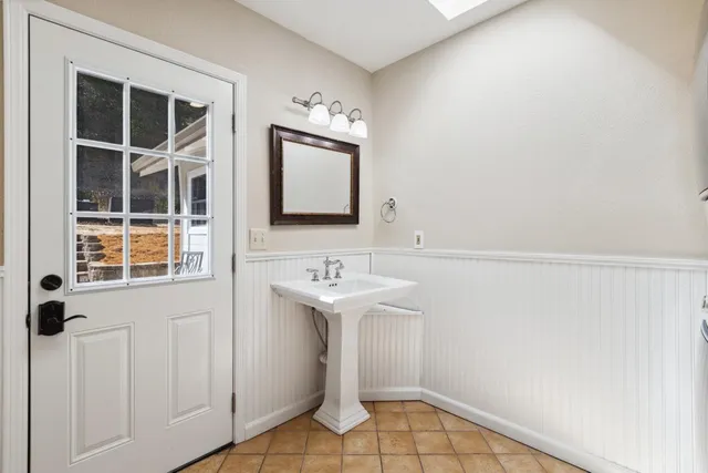 a view of a patio with table and chairs and potted plants