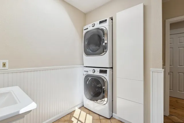 a view of a dinning table and chairs on roof deck