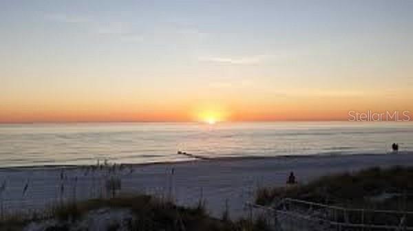 14048 Gulf Boulevard, Unit 401 Madeira Beach, FL 33708 - Photo 14 of 14 a view of an ocean and beach